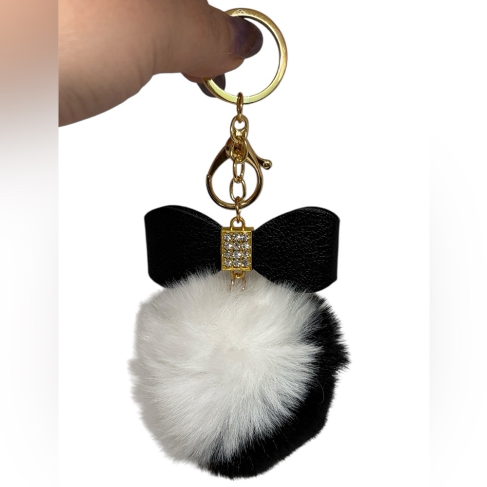 Chic Black and White Pom Pom Keychain with Gold Accents